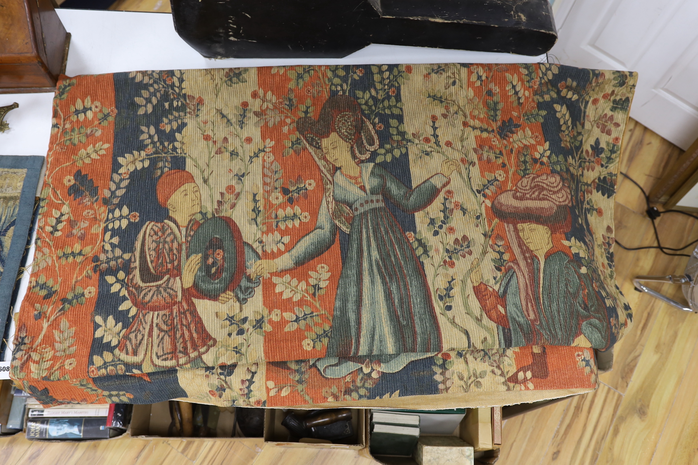 A machine tapestry manufactured by Robert Four, depicting a Medieval figurative scene, 160cm wide, 127cm high